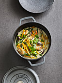 Thai pumpkin and prawn curry in a pot