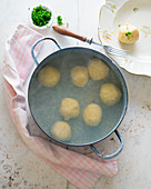 Cooked potato dumplings and chives