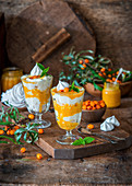 Trifles with meringue, cream and sea buckthorn curd