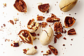 Cracked and opened pecan nuts and nuts in shell