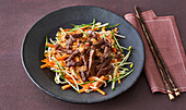 Vietnamese beef with a vegetable salad and peanut sauce
