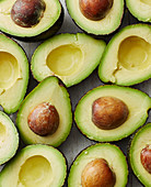 Halved avocados pitted and unpitted