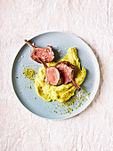 Saddle of lamb with mashed pistachios (slow cooking)