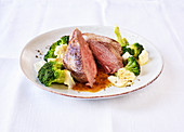 Marinated lamb rump steaks with broccoli (slow cooking)