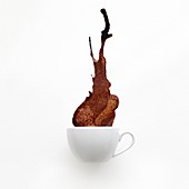 Cup of coffee spilling