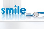 The word 'smile' in blue letters with toothbrush