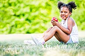 Girl holding apple