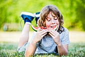 Boy eating watermelon