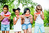 Children eating watermelon