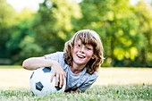 Boy playing with football