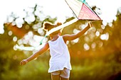 Girl playing with kite