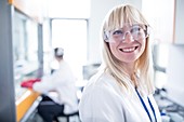 Doctor wearing protective goggles and smiling