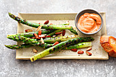 Sous vide green asparagus with salted almonds and a dip