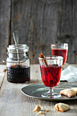 Red wine punch and Christmas biscuits on a metal plate