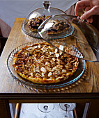 Italian apple pie under a glass dome