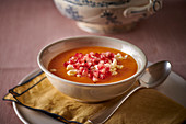 Pumpkin soup with feta cheese and pomegranate seeds