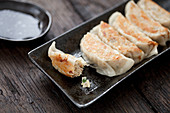 A platter of Gyoza with Soy dipping sauce