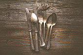 Antique cutlery on a wooden table