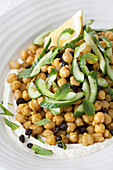 Chickpea salad topped with cucumber and mint