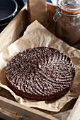 Beautifully decorated chocolate torte in a vintage tray