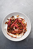 Stewed rhubarb and a nutty cumble topping with cream