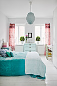 Pleasant white bedroom with colourful accents