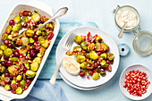 Brussel sprouts baked with grapes and walnuts, tahini yogurt
