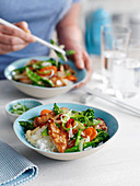 Wok chicken with colourful vegetables and rice