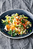 One-pot quinoa salad with apple, cos lettuce, carrots and spring onions