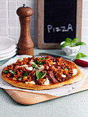 Pizza with minced meat and sausage