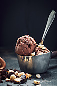 Vegan coconut chocolate ice cream with brownies and hazelnuts