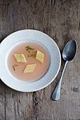 Clear apple soup with polenta slices