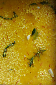 Risotto rice in a saffron broth