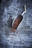 Szechuan pepper in a metal scoop