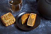 Moon cake from China with a baked egg yolk, served with tea