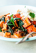 Pumpkin curry with spinach, close up