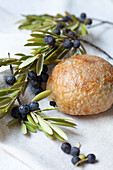 An olive roll with olive branches