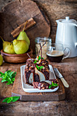 Chocolate almond cake with whole poached pears