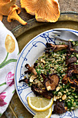 Farro with spinach sacue and fried mushrooms