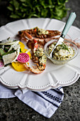 Grilled prawns with herb butter and a side salad