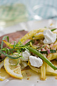 Bean salad with lemons and goat's cheese with roast beef