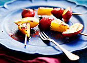 Grilled fruit skewers with pineapple, strawberries and nectarines