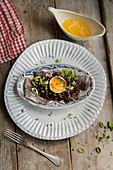 Herring with spring onions, browned butter and an egg yolk