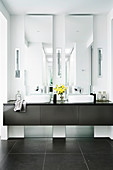 Two vertical mirrors on the double washbasin