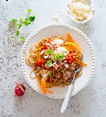 Spaghetti with tuna, tomatoes, carrots and Parmesan cheese