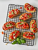 Crostini with tomatoes and roasted pine nuts