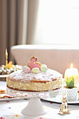 Cheesecake decorated for Easter on a cake stand