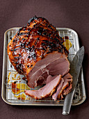 Honey glazed ham with knife