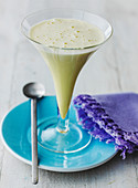 Zabagalione in a tall glass with purple napkin