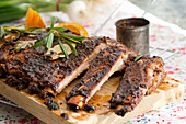 Grilled ribs on a chopping board